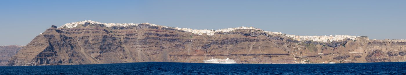 The crater rim with the towns of Imerovigli, Firostefani and Fira seen from the caldera
