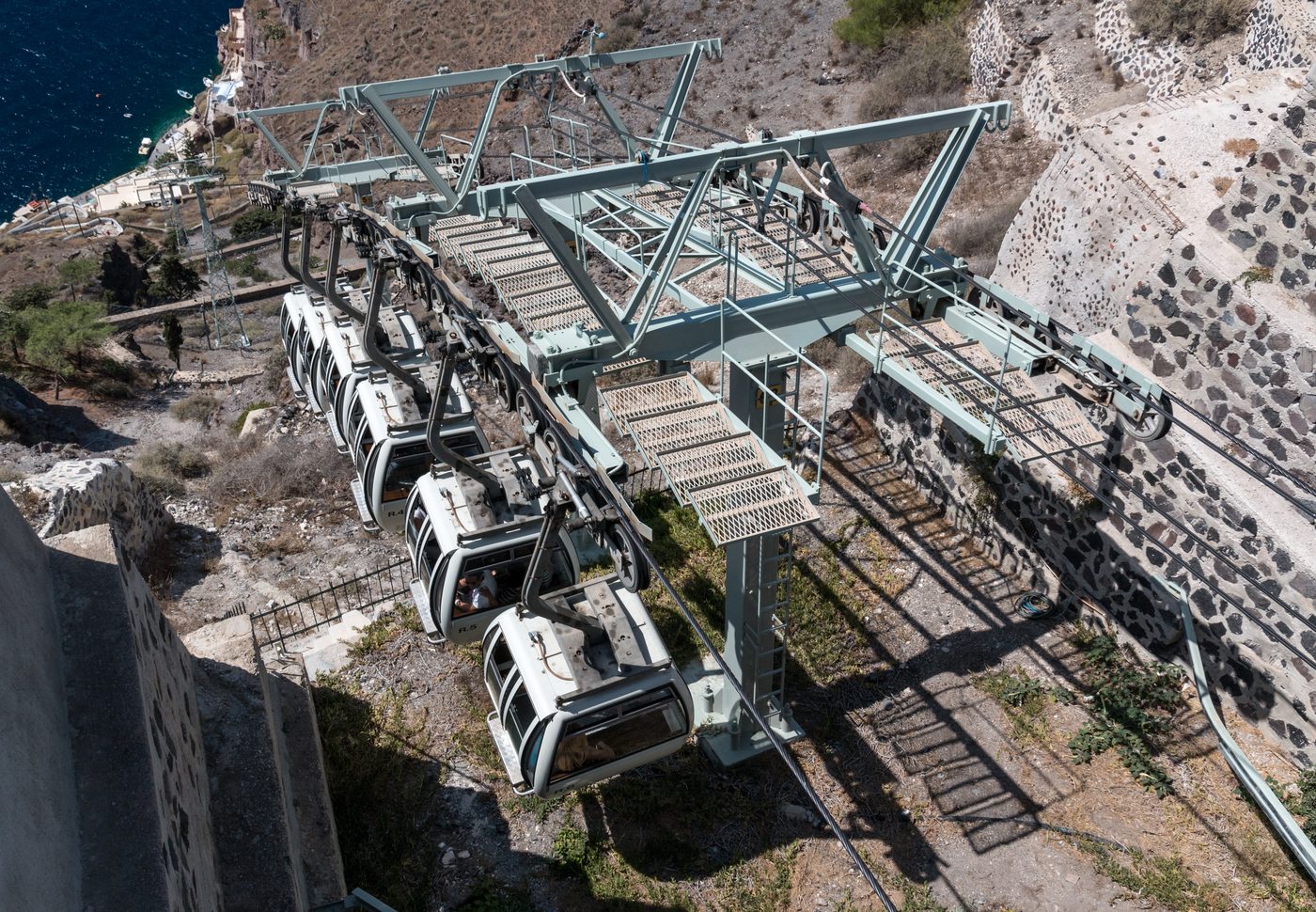 The Fira cable car descending the volcanic cliffs to the Old Port below
