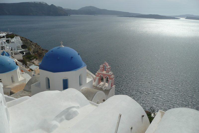 Walkers on the caldera-edge trail between Fira and Oia on Santorini.