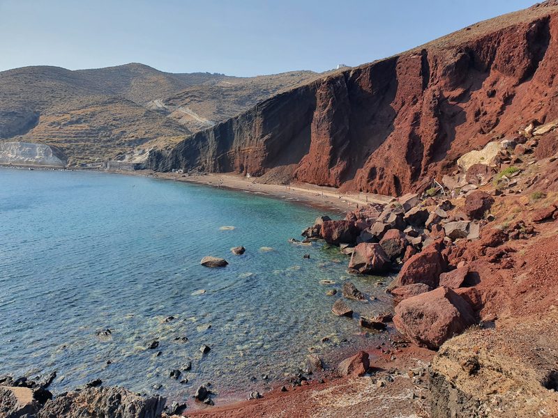 Red Beach in Santorini, its dark red cliffs towering above the narrow beach