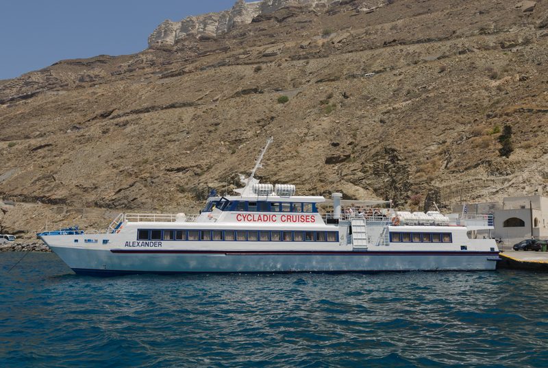 A Cycladic Cruises boat tours the caldera in Santorini, Greece.