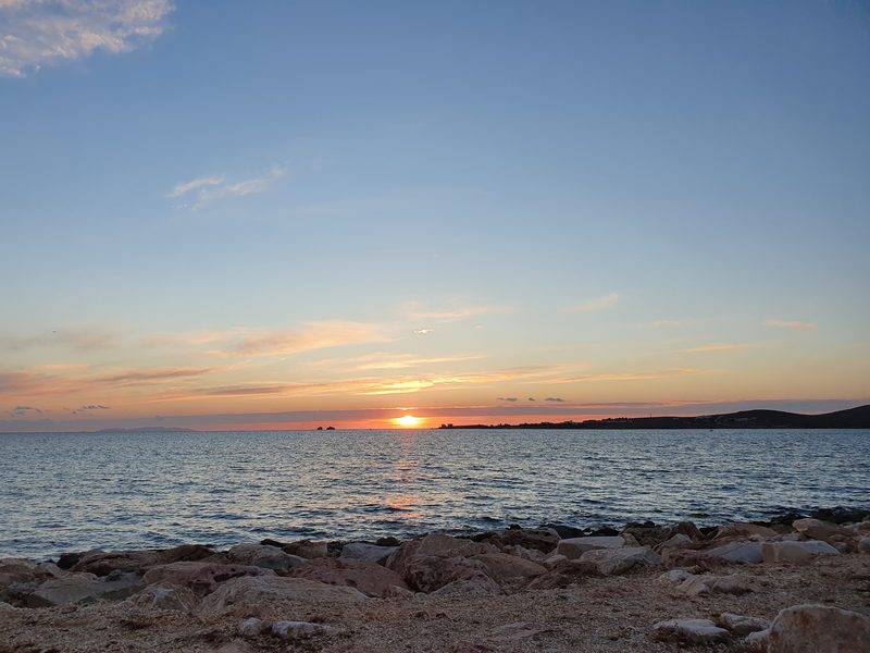 Sunset over the sea from the waterfront at Parikia on Paros