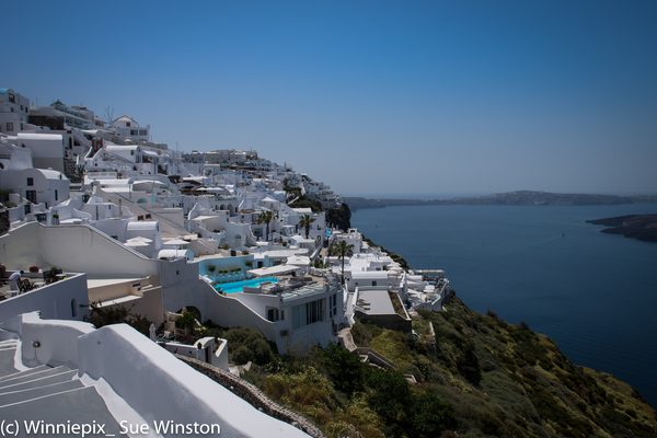 A traditional whitewashed building overlooking the caldera in Firostefani, Santorini