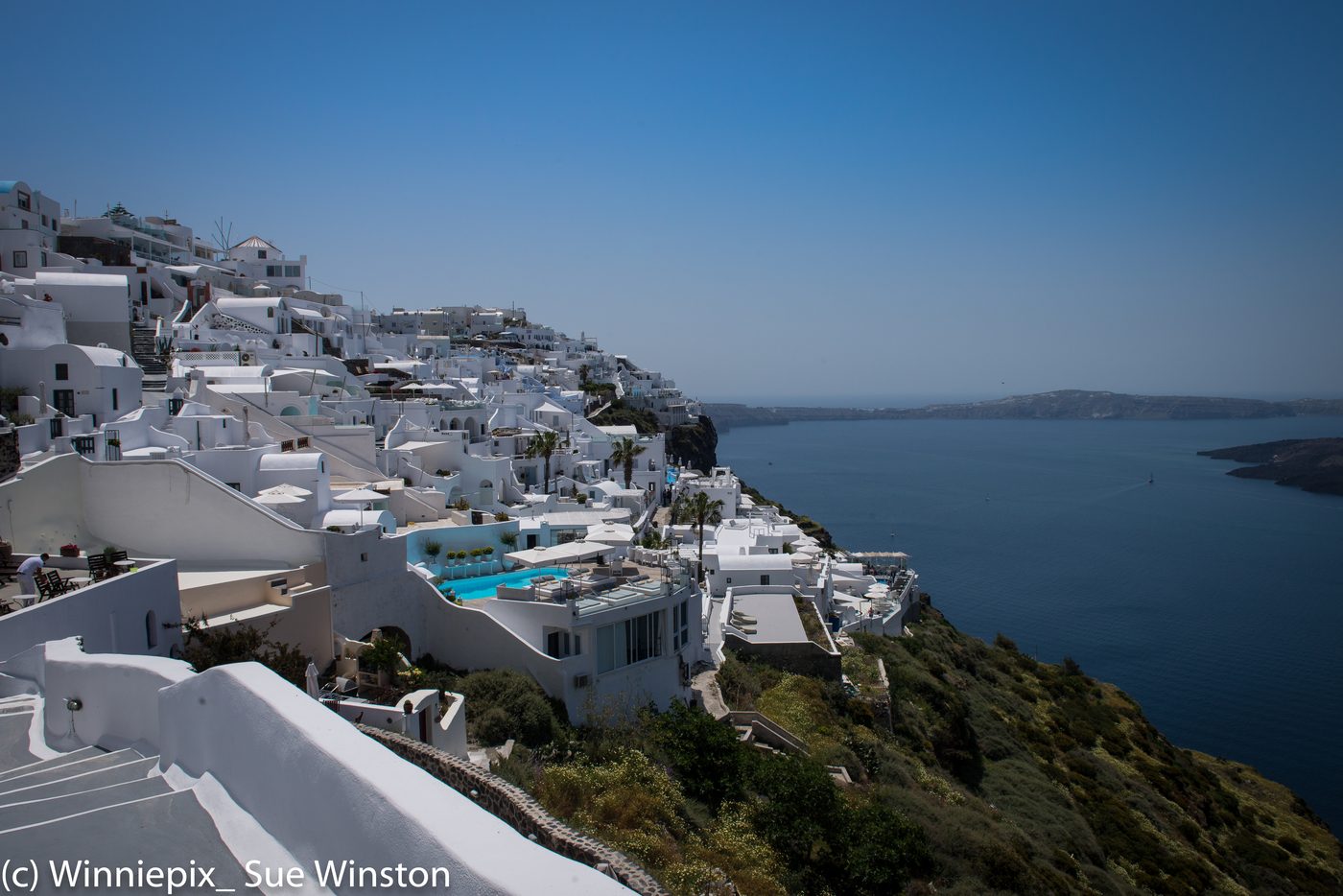 A traditional whitewashed building overlooking the caldera in Firostefani, Santorini