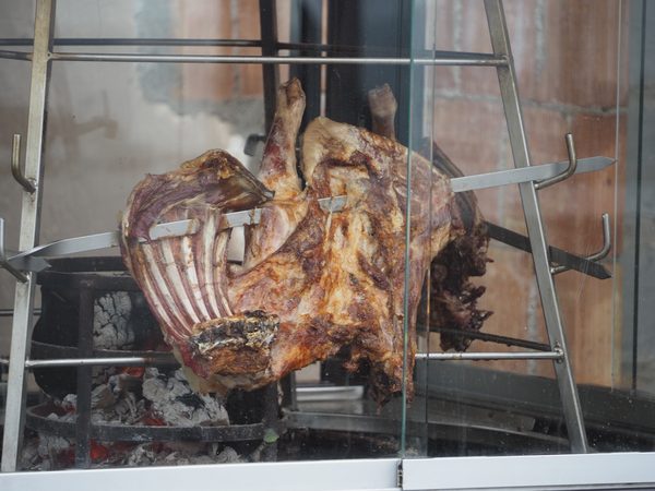 Traditional Greek lamb cooked in an outdoor oven in Santorini
