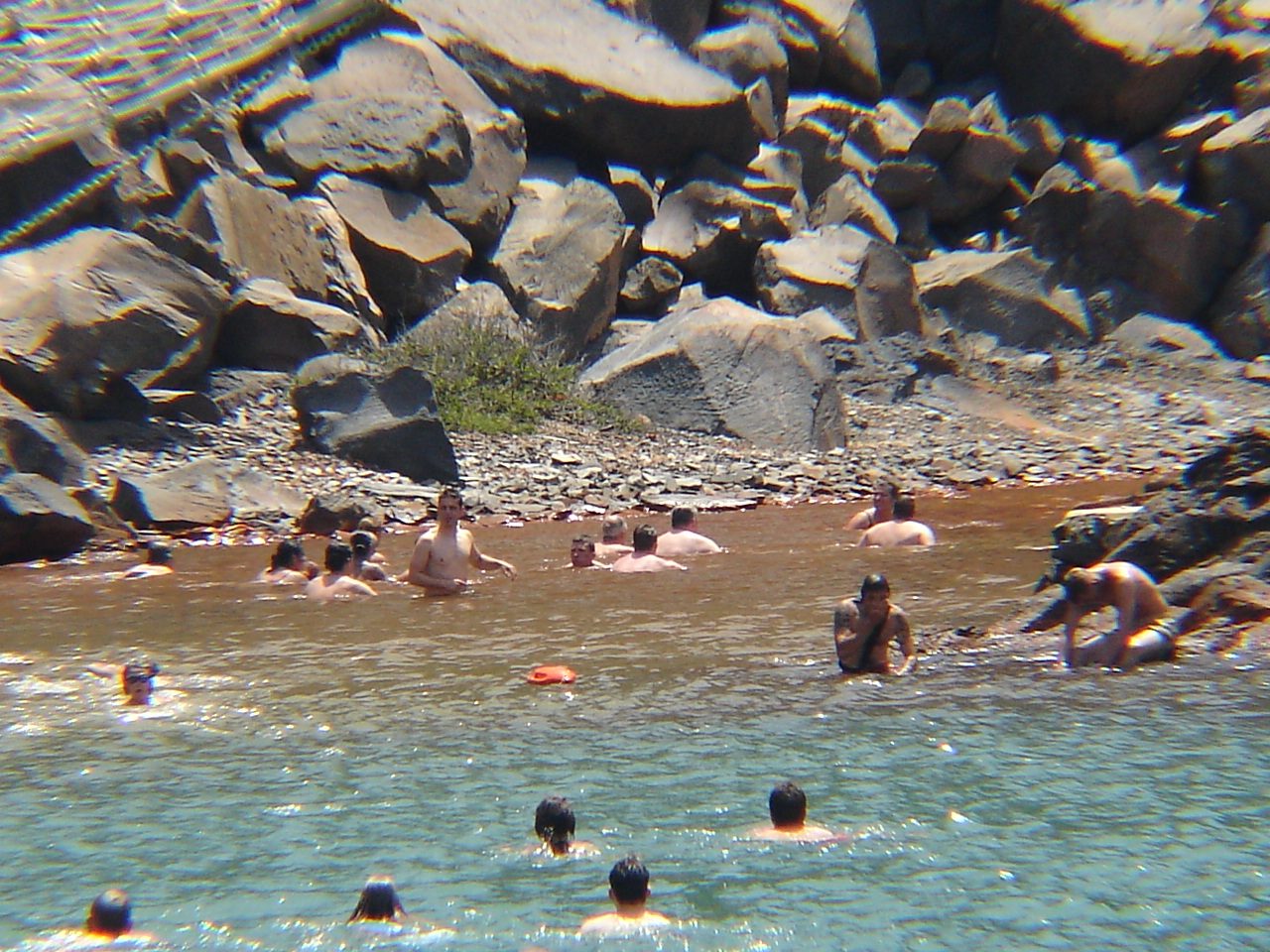 The yellowish sulphurous hot springs of Palea Kameni in the Santorini caldera